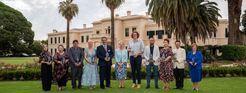 Winners standing in a row with there awards