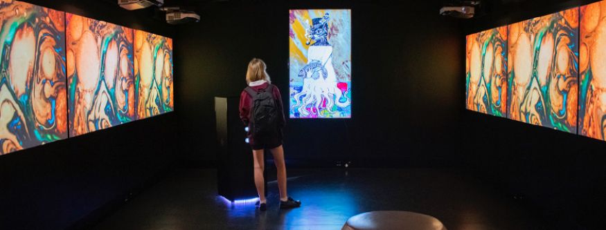 A student plays with the interactive Exquisite Familiar artwork in The Pod at MOD. Photo: Georgina Smerd.