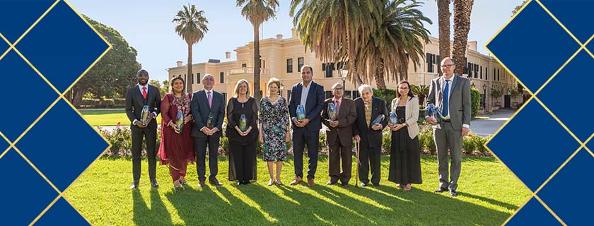 9 winners of the 2022 Governor's Multicultural Awards with their trophies and the Governor of South Australia